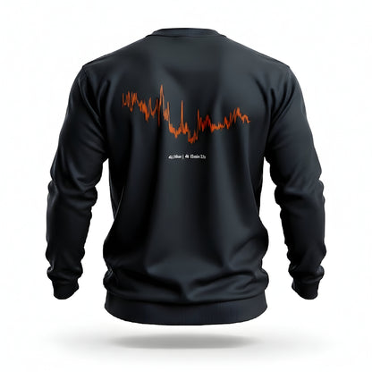 Black sweatshirt with orange custom Strava route print art design on the back against a white background
