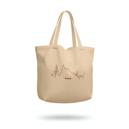 Beige tote bag with a custom Strava route print art design on a white background