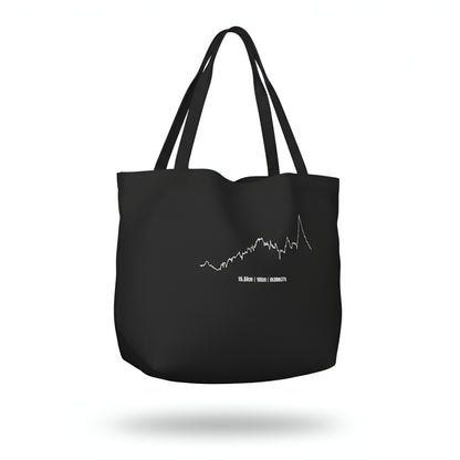 Black tote bag with a white custom Strava route print art design on a white background