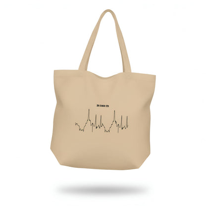 Beige tote bag with a black custom Strava route print art design and text on a white background