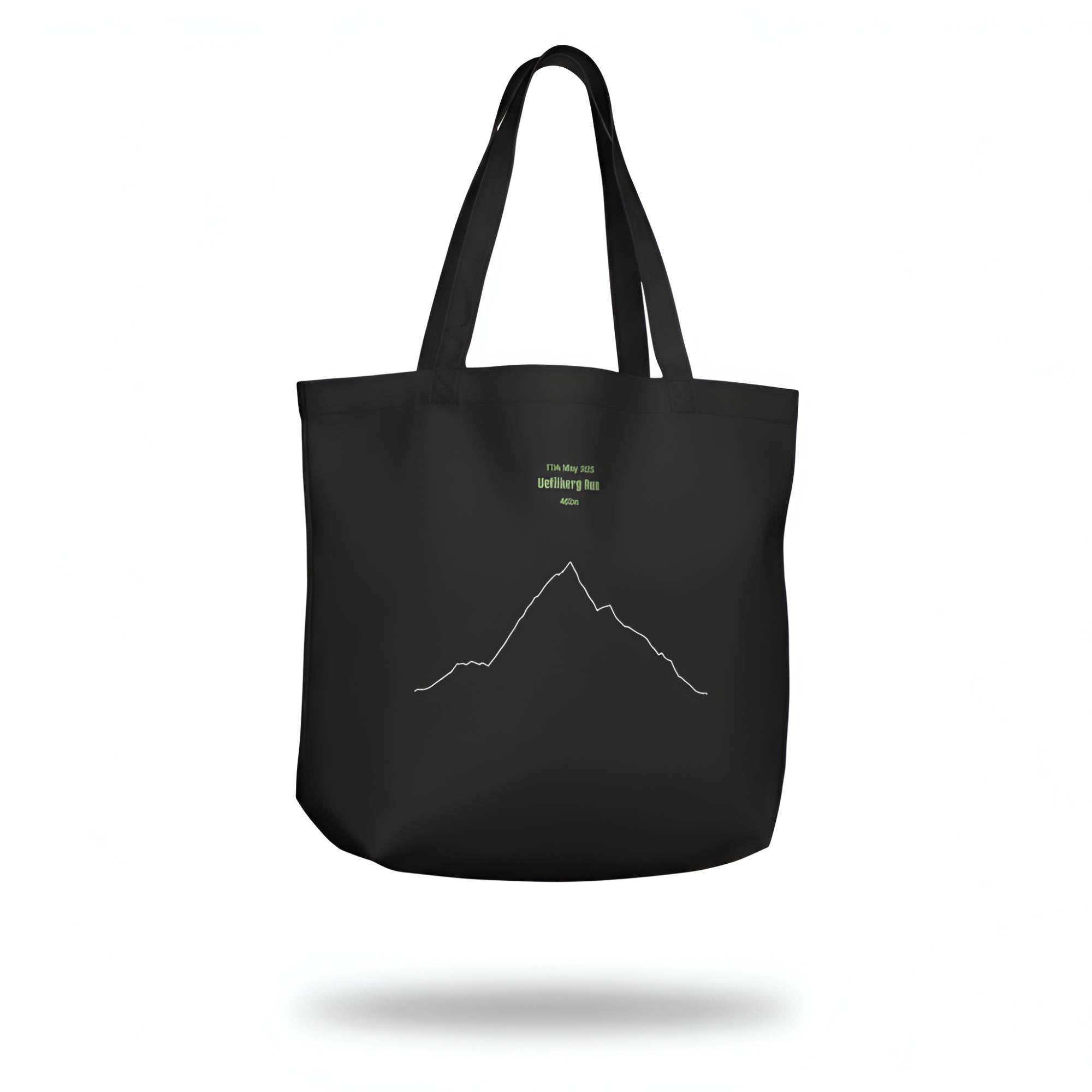 Black tote bag with custom Strava route print art design and text on a white background