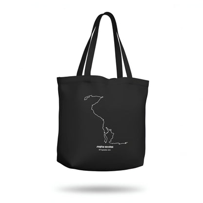 Black tote bag with a white custom Strava route print art design on a white background