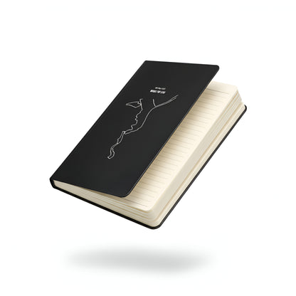 Black notebook with custom Strava route print art design white interior pages on a white background