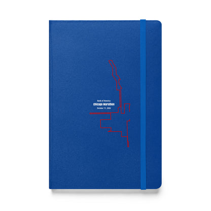 Blue notebook with red custom Strava route print art design on a white background