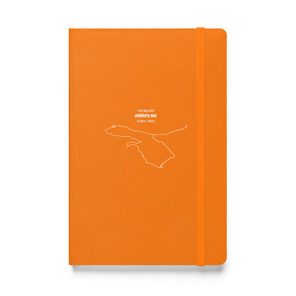 Orange notebook with white custom Strava route print art design on a white background