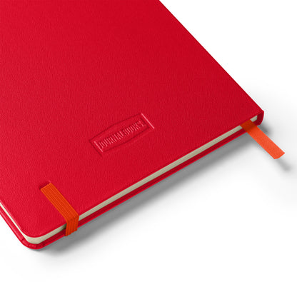 Red notebook with orange binding on a white background