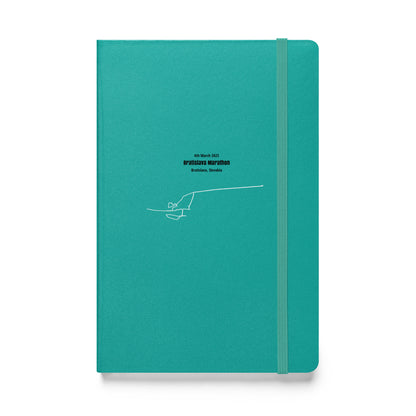 Teal notebook with custom Strava route print art design on a white background