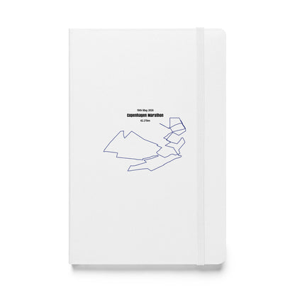 White notebook with black custom Strava route print art art and text on a white background
