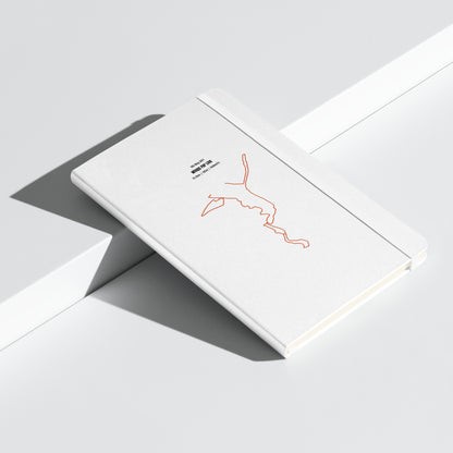White card with a red custom Strava route print art on a gray surface