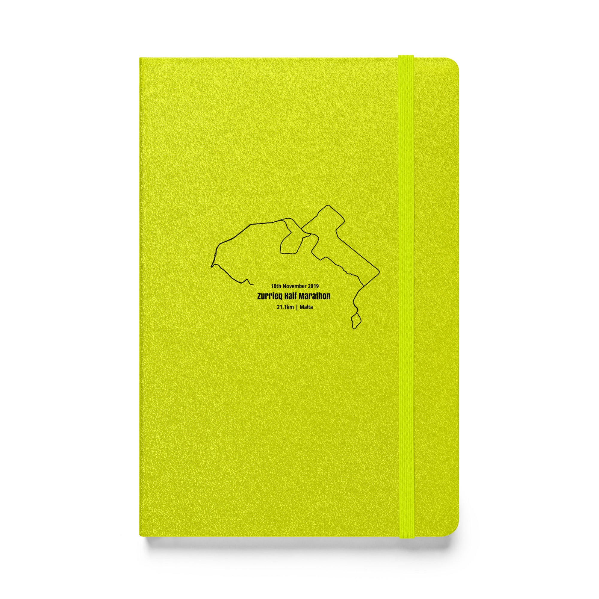 Yellow notebook with a black custom Strava route print art on a white background
