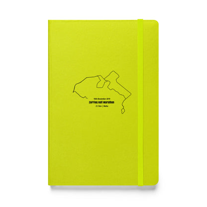 Yellow notebook with a black custom Strava route print art on a white background