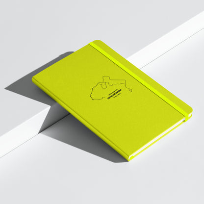 Yellow notebook with custom Strava route print art on a white background