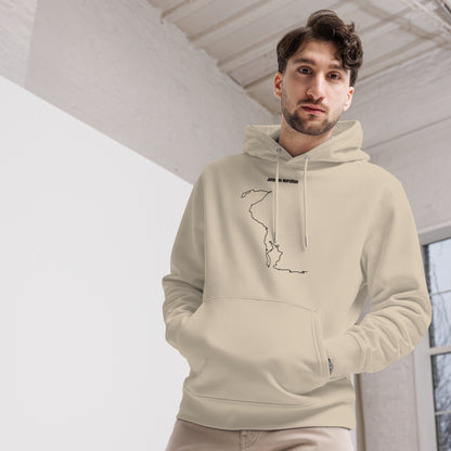 Man wearing a beige hoodie with a custom Strava route print art design indoors