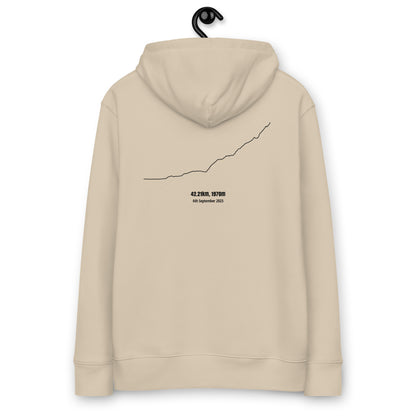 Beige hoodie with a custom Strava route print art design on the back, hanging against a white background