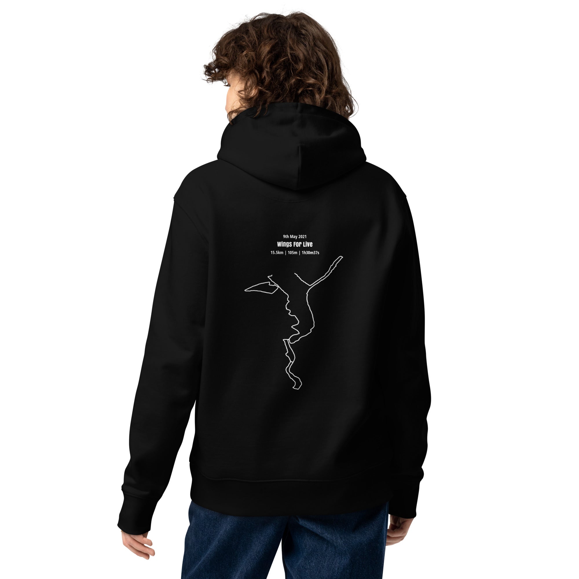Person wearing a black hoodie with a white custom Strava route print art on the back, standing against a white background