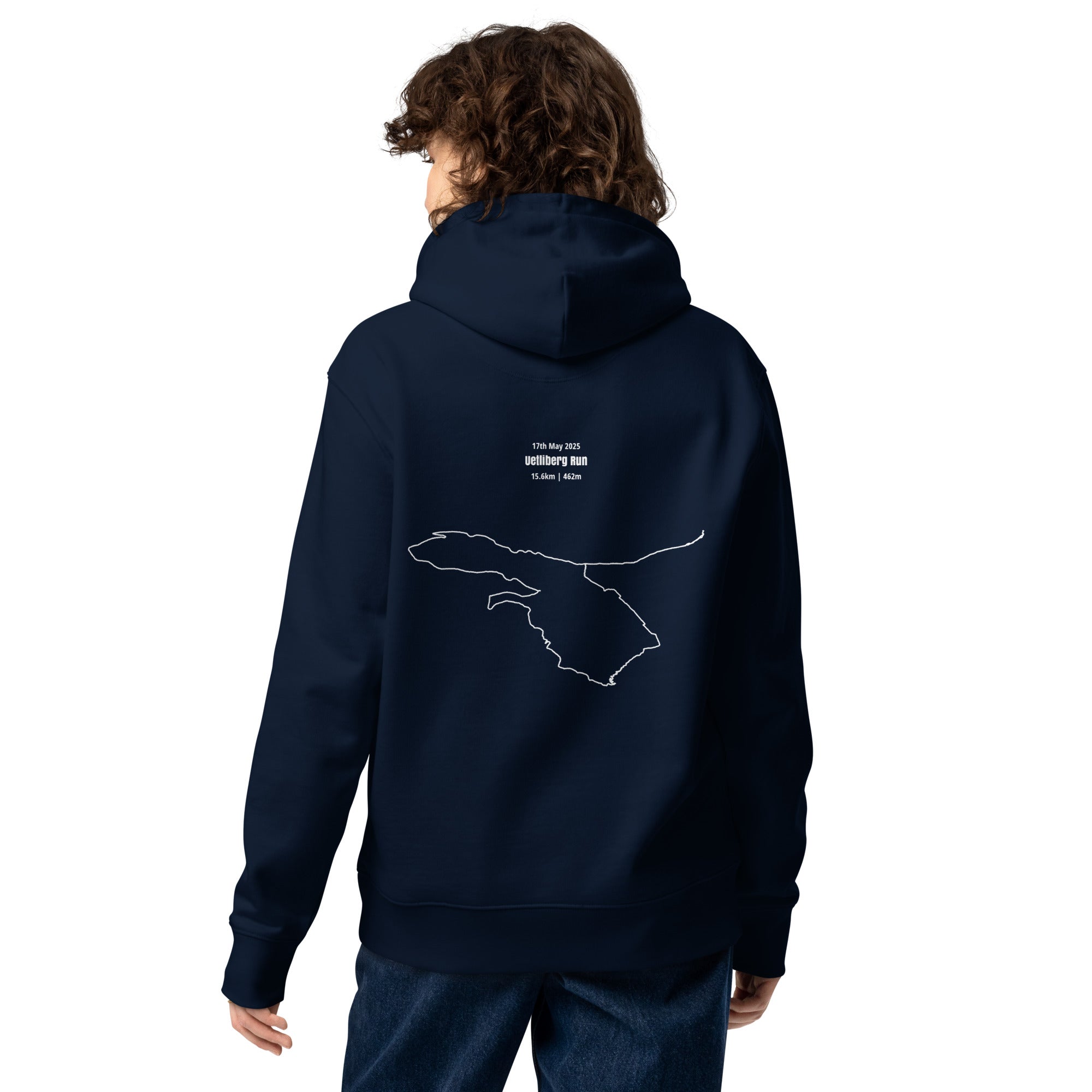 Person wearing a navy blue hoodie with a custom Strava route print art design on the back against a white background