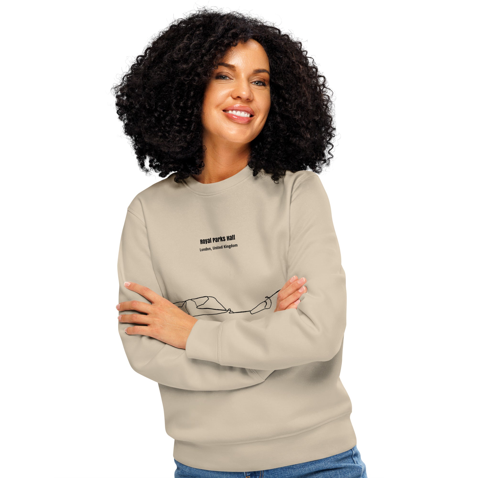 Woman wearing a beige sweatshirt with text and custom Strava route print art on a white background