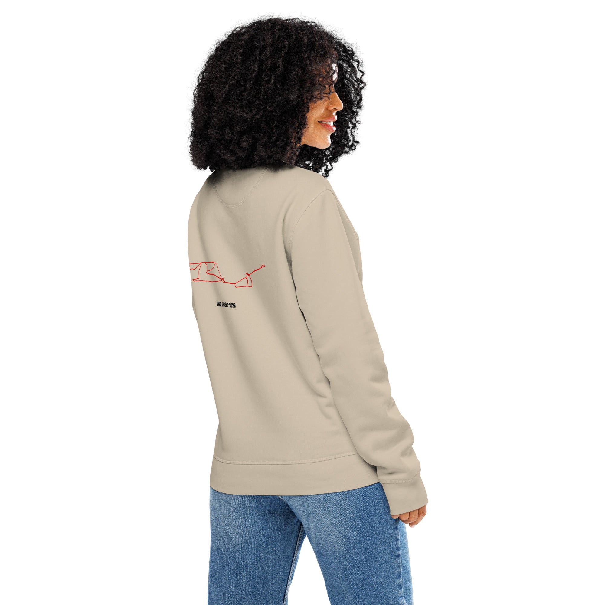 Person wearing a beige sweatshirt with red custom Strava route print art on the sleeve against a white background