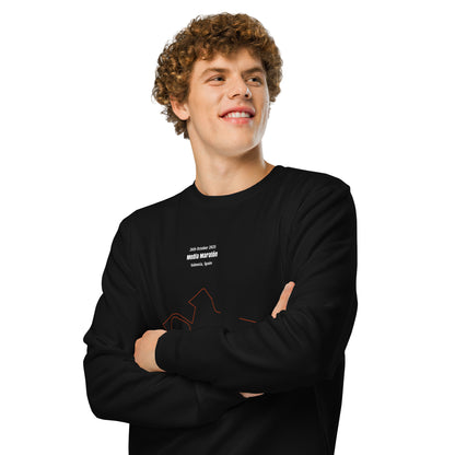Man wearing a black long-sleeve shirt with text and custom Strava route print art on a white background
