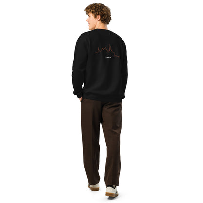 Person wearing a black sweatshirt with custom Strava route print art design on the back, standing against a white background