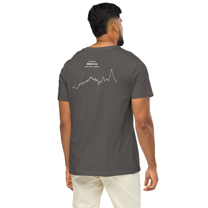 Man wearing a dark gray t-shirt with a custom Strava route print art design on the back, standing against a white background