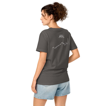 Woman wearing a gray t-shirt with a custom Strava route print art design on the back, standing against a white background