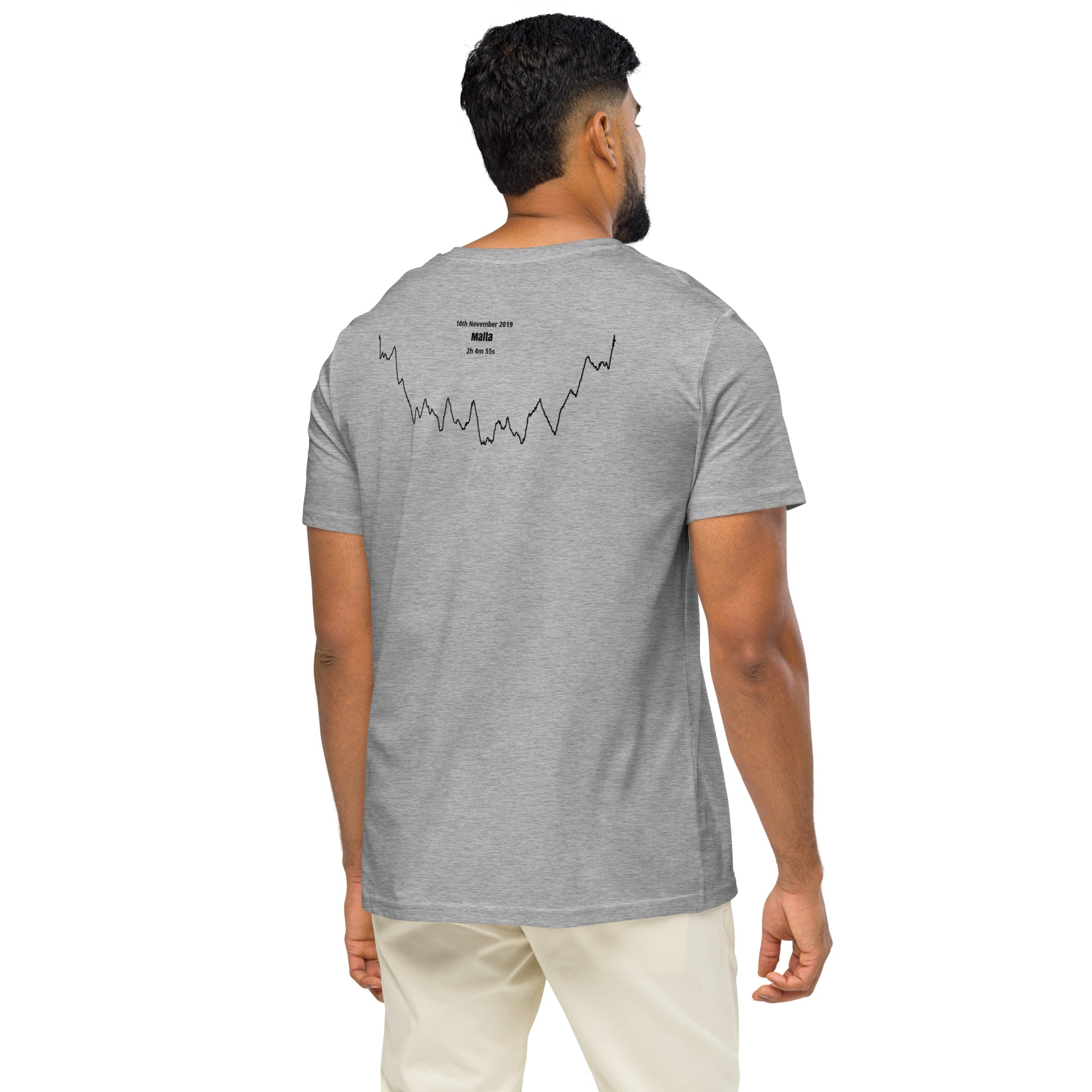 Man wearing a gray t-shirt with a custom Strava route print art design on the back, standing against a white background