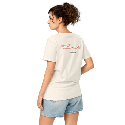 Woman wearing a white t-shirt with a red custom Strava route print art on the back, standing against a white background
